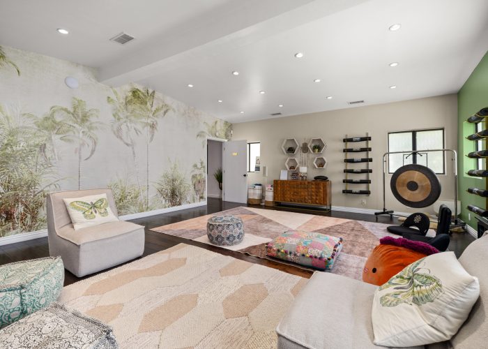 a cozy and relaxed living space with comfortable seating, patterned pillows